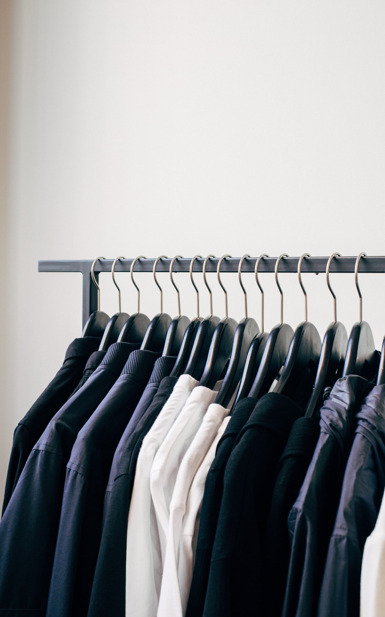 Collection of Designer Clothes on Rack